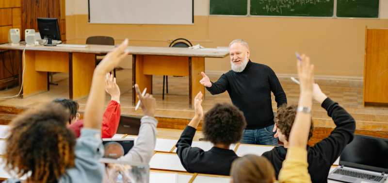 Male teacher with class B1 TEFL Lesson plans